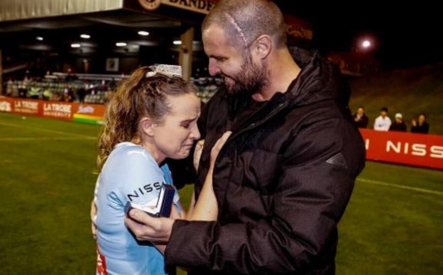 Melbourne City’s Rhali Dobson gets engaged on the pitch after retiring to support ill partner