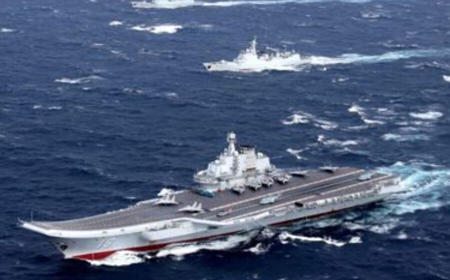 China flanks Taiwan with military exercises in air and sea