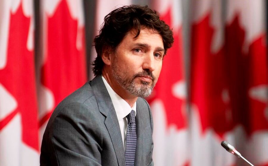 Justin Trudeau hangs on to power in Canadian election to form minority government
