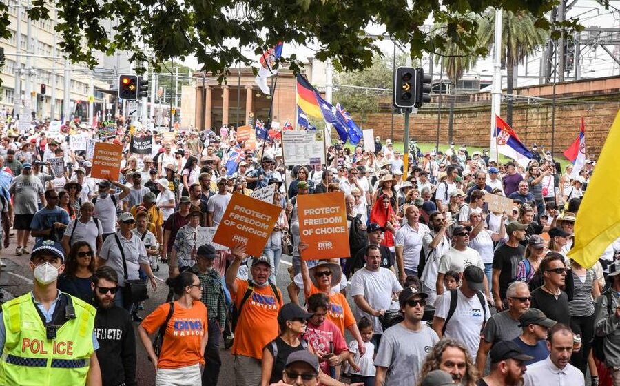 Anti-vax protesters take to Sydney streets as state records nearly 50,000 new cases, 20 deaths