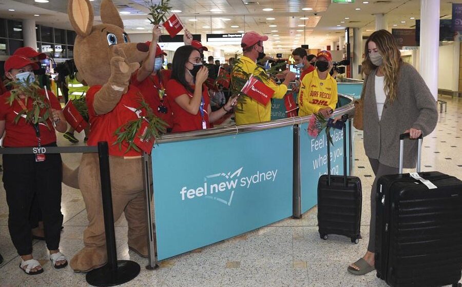 International tourists welcomed back with toy koalas, Tim Tams